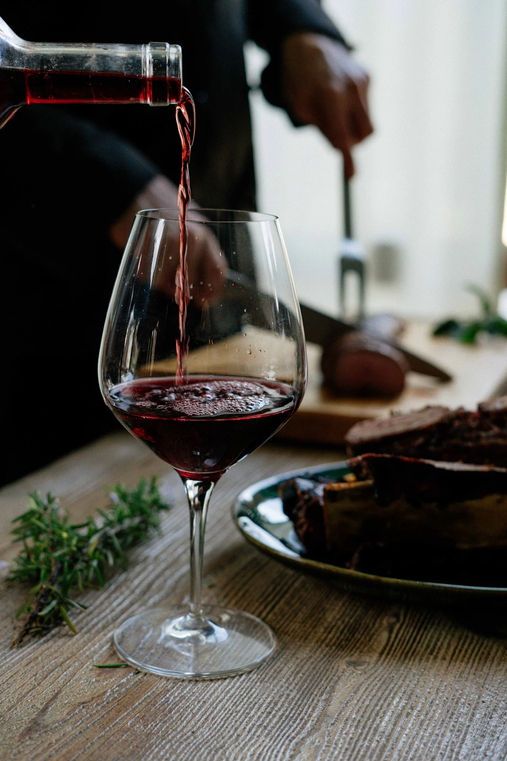 Red wine being poured into a glass