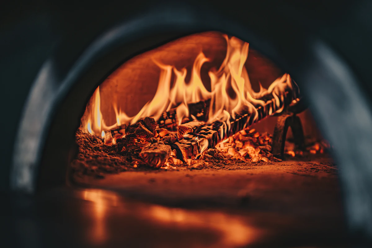 Embers glowing in the wood-fired oven